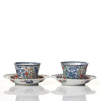 A pair of famille verte cups with stands, Qing dynasty, Kangxi (1662-1722).