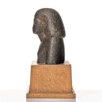 An Egyptian granite bust of an official, Middle Kingdom ca 1900 B.C.