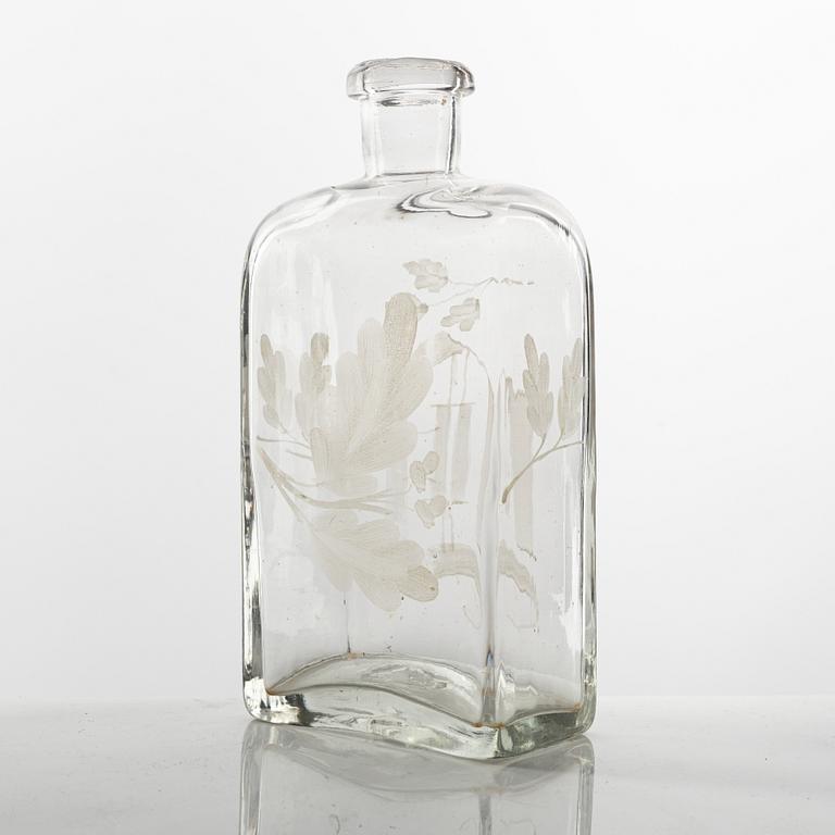 A set of three glass bottles and one decanter, 19th Century.