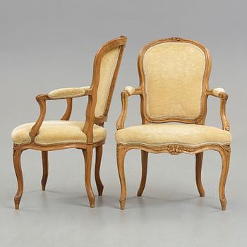 Two matched Louis XV 18th century armchairs.