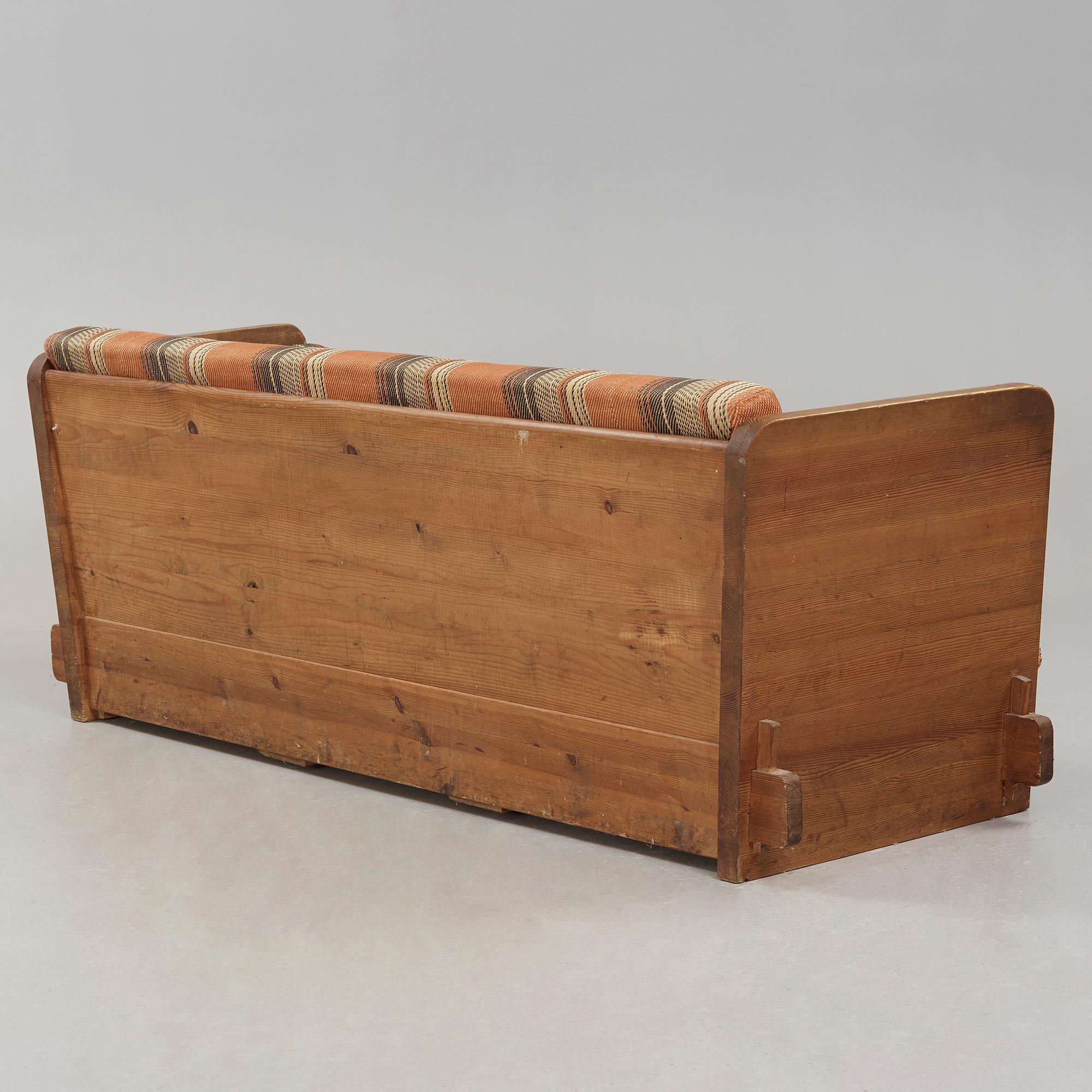 An Axel Einar Hjorth stained pine 'Lovö' sofa, Nordiska Kompaniet, Sweden ca 1930.