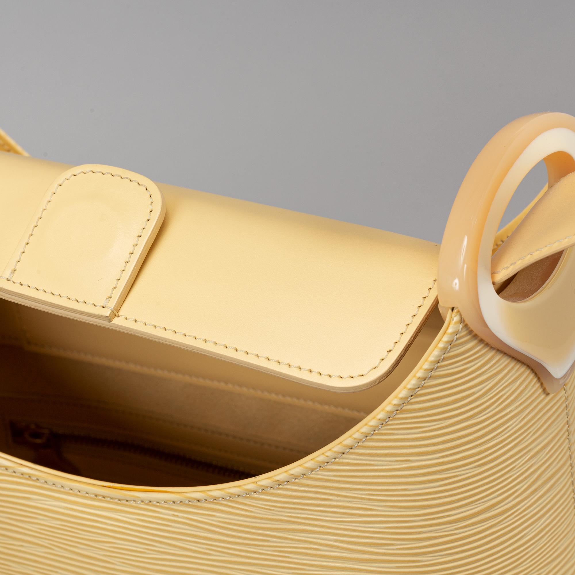 Louis Vuitton, 'Verseau Vanilla Epi leather bag' and wallet.