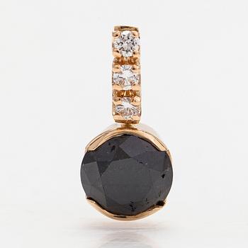 A 14K gold pendant with a black diamond approx. 2.66 ct according to certificate and brilliant cut diamonds.