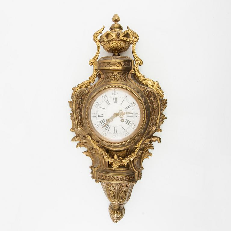 Wall clock in Louis XV style, circa 1900.