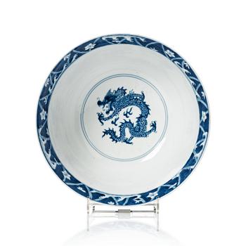 A blue and white four clawed dragon bowl, Qing dynasty, with Kangxis six character mark and period.