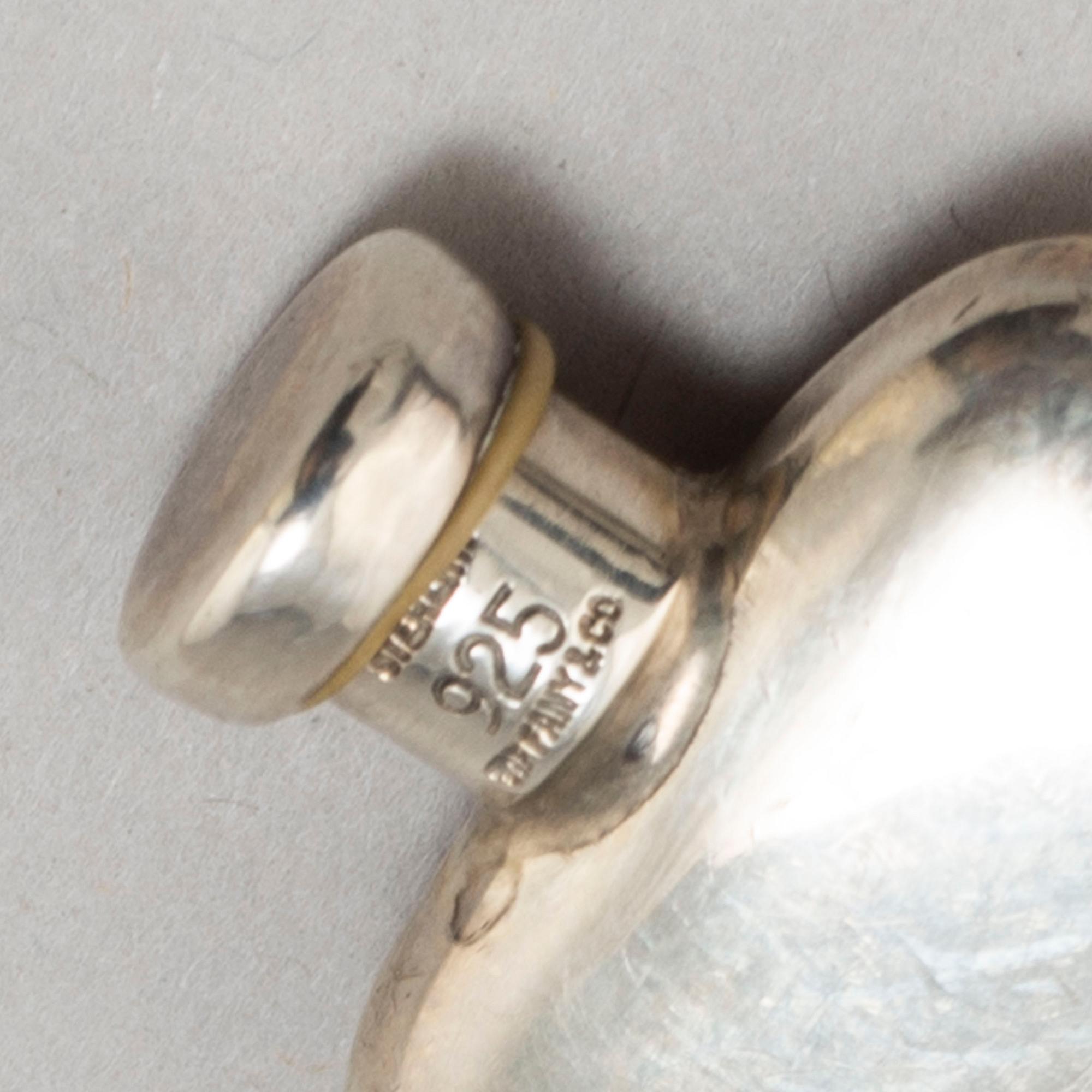 A TIFFANY & CO PERFUME BOTTLE, silver.