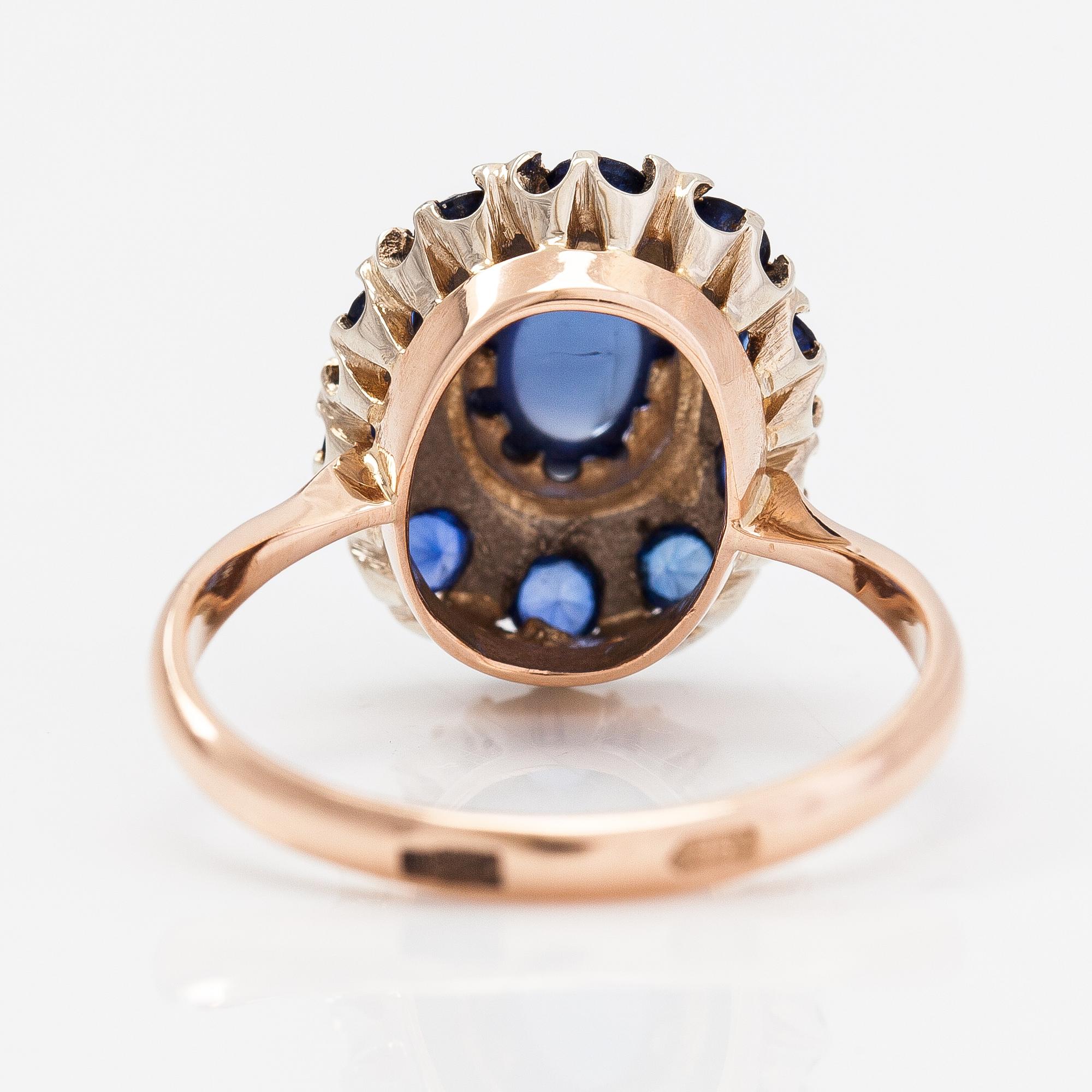 A 14K gold ring with a cabochon-cut synthetic sapphire and real sapphires. Yerevan.