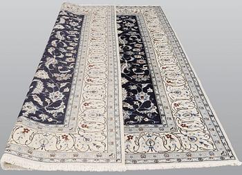A carpet, Nain, part silk, ca 350 x 247 cm.