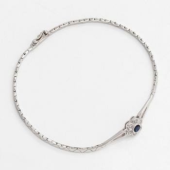 A 14K gold bracelet with sapphire and diamonds totalling approx. 0.12 ct. Finnish import hallmark.
