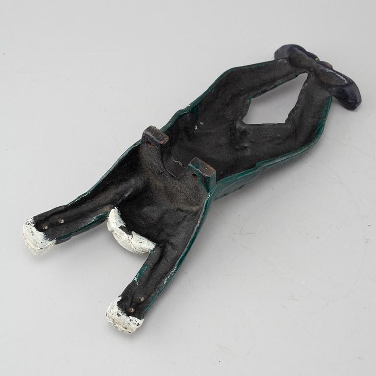 A 20th century cast iron boot jack.