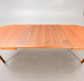 A Nils Jonsson teak and walnut 1960s dining table.