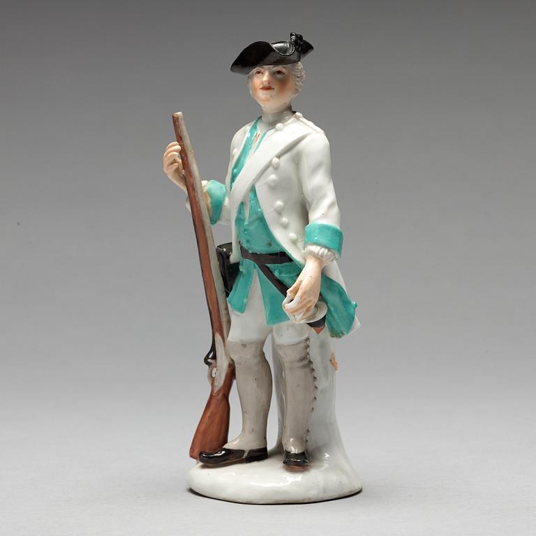 A German unmarked porcelain figure of a huntsman, 18/19th Century.