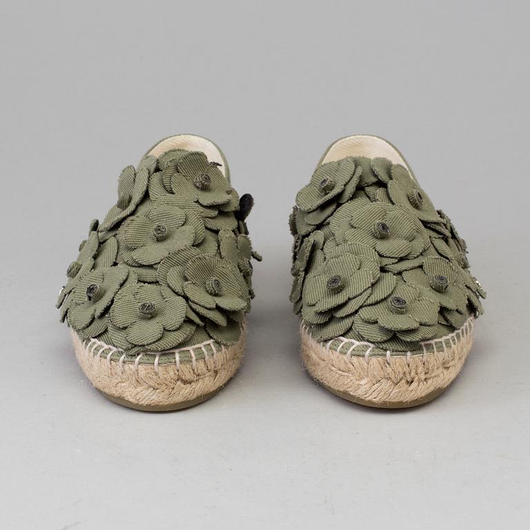 A pair of espadrilles from Chanel.