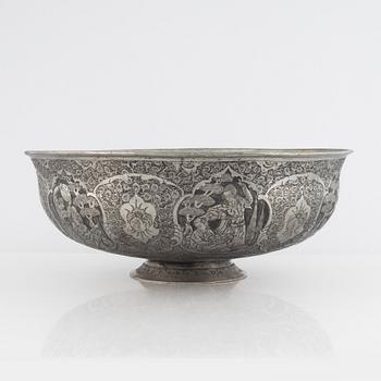 A west Asian repoussé silver and copper vessle, circa 1900.
