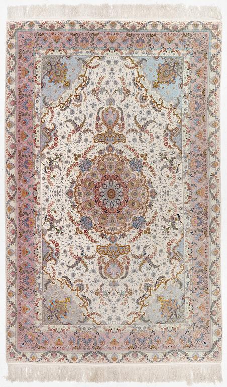 A Tabriz carpet north west Persia, part silk, c. 314 x 197 cm.