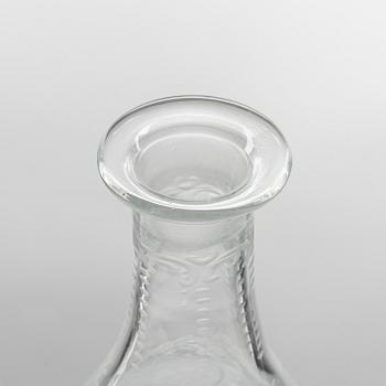 A set of three glass bottles and one decanter, 19th Century.