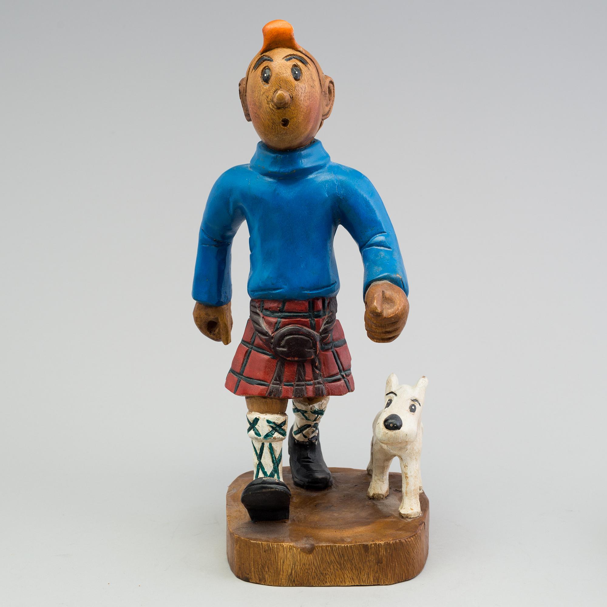 a Tintin and snowy wood scuplture from the second half of the 20th century.