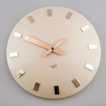 A 20th century wall clock by LM Ericsson.