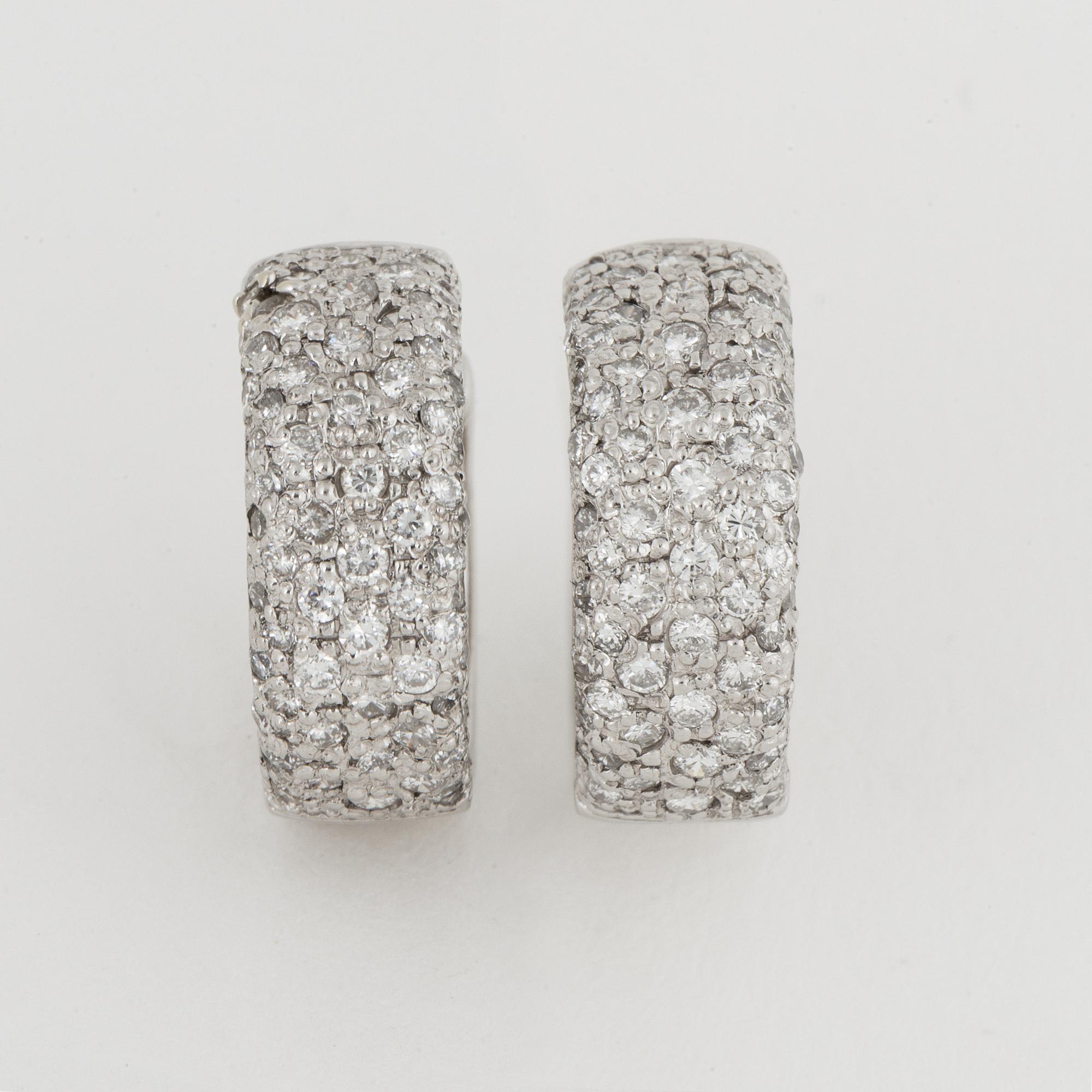 Platinum and brilliant-cut diamond earrings.