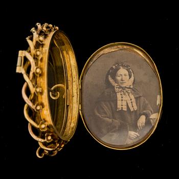 BROSCH/BERLOCK, 18K guld. Gustaf Adolf Cedergren, Stockholm, 1800-talets andra hälft.