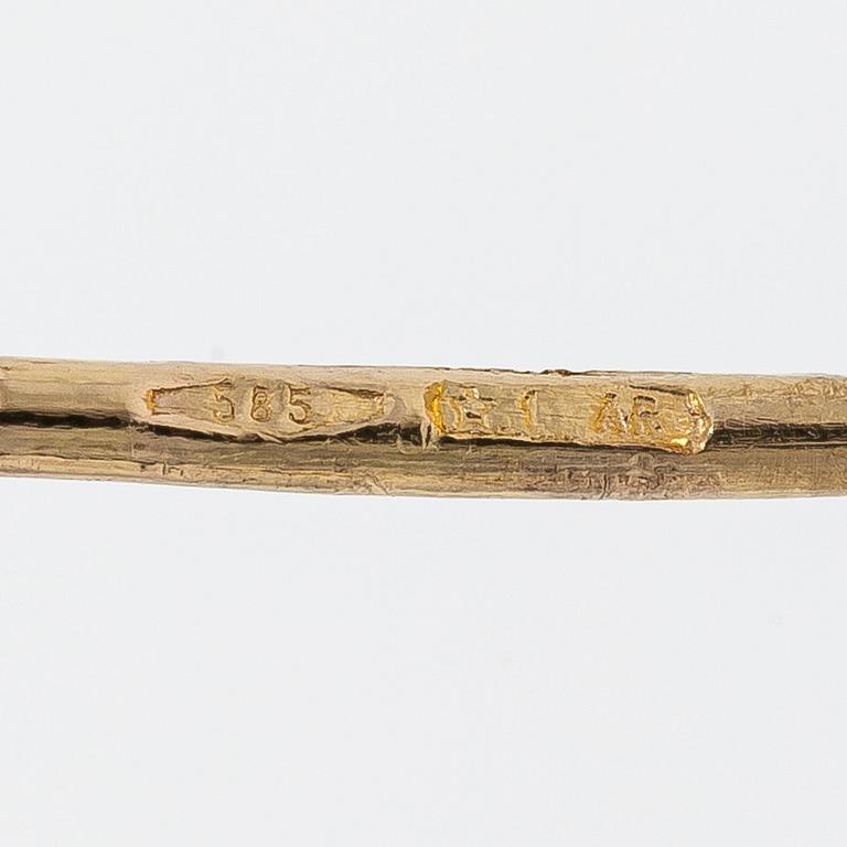 A pair of 14K gold earrings.