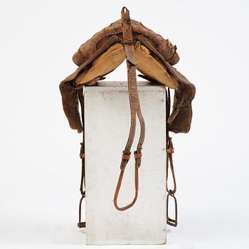 A leather saddle of Caucasian type, dated 1821.