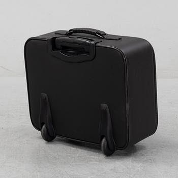 Bottega Veneta, an intrecciato leather suitcase.