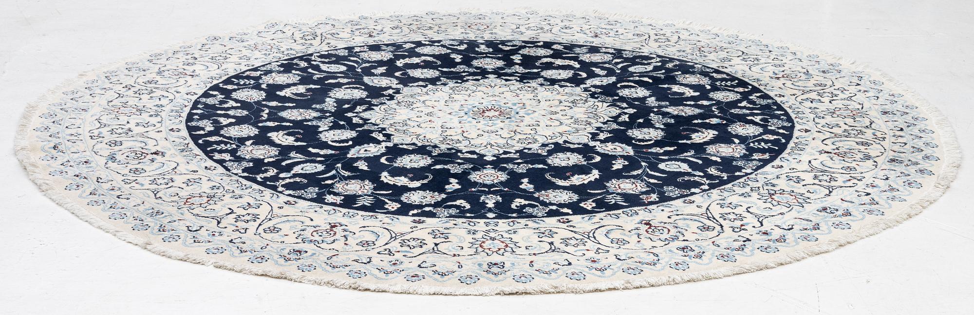 A Nain rug, diameter 243 cm.