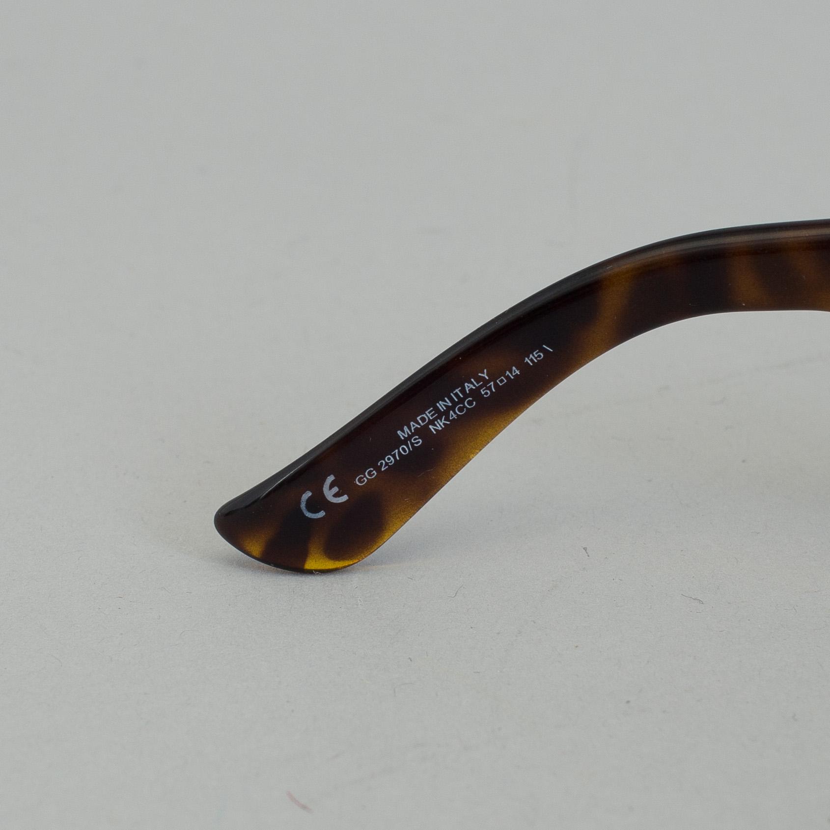 A pair of Gucci GG2970/S sunglasses with case.