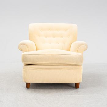 Josef Frank, a model 568 armchair by  Firma Svenskt Tenn.