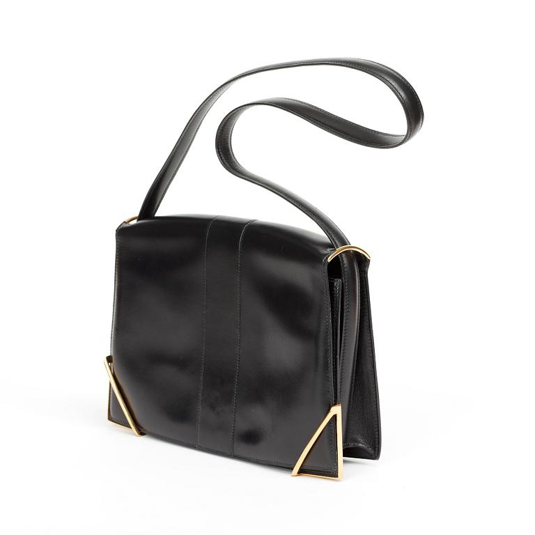 A 1970s black shoulder bag by Hermès.