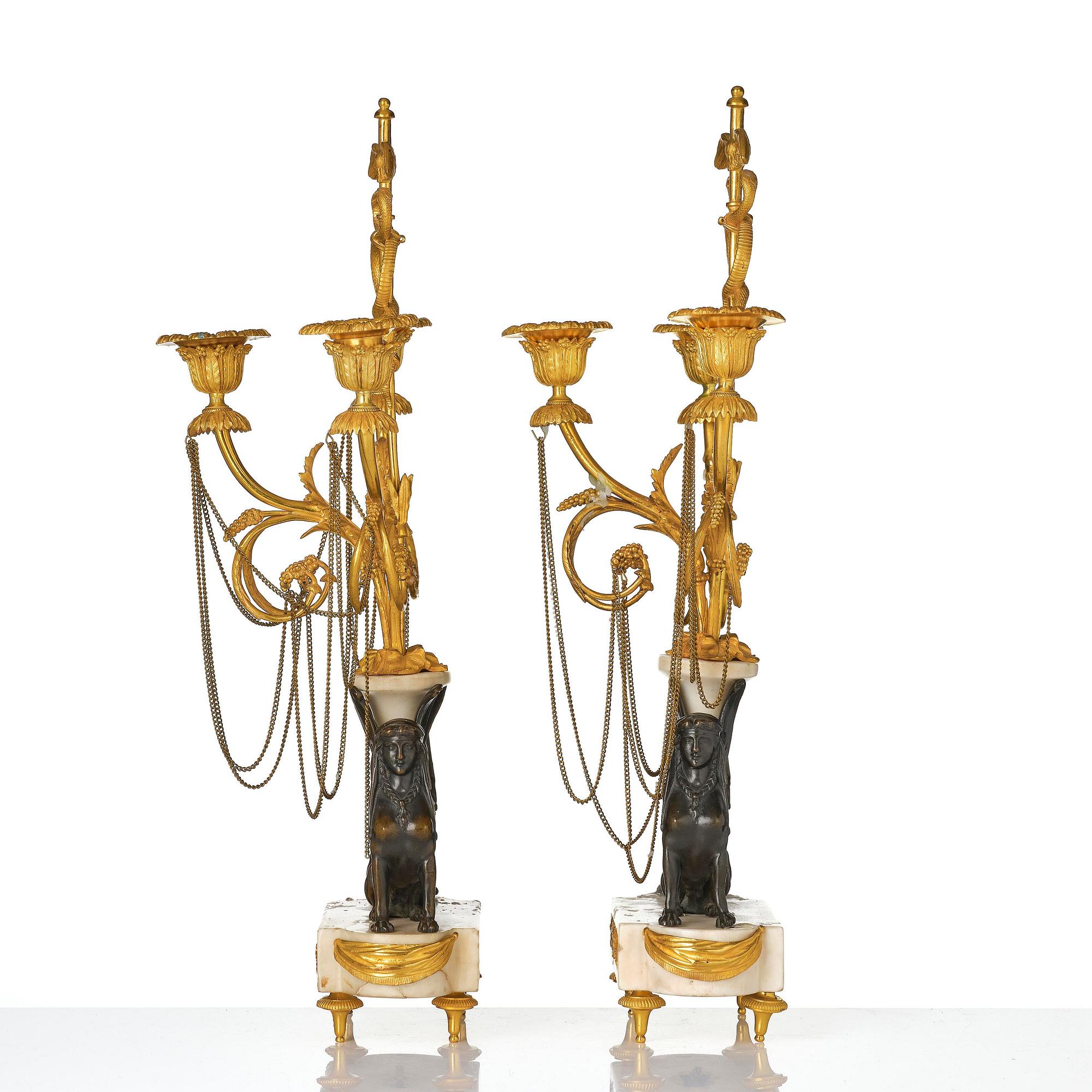A pair of Louis XVI three lights Candelabra, Parisian works, in the manner of François Rémond, late 18th century.
