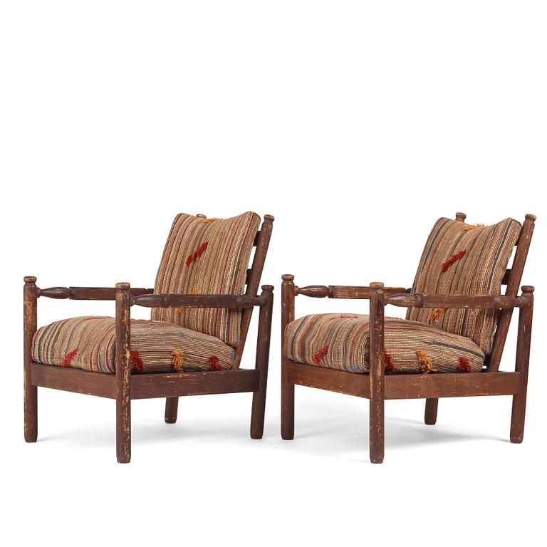 Axel Einar Hjorth, a pair of stained pine "Sandhamn" easy chairs, Nordiska Kompaniet, Sweden, 1929.