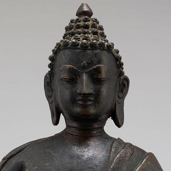 A Thai bronze buddha, 20th century.