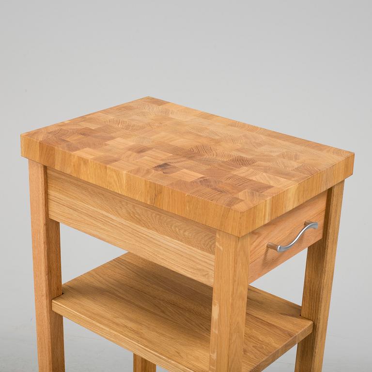 A 21th century oak kitchen island.