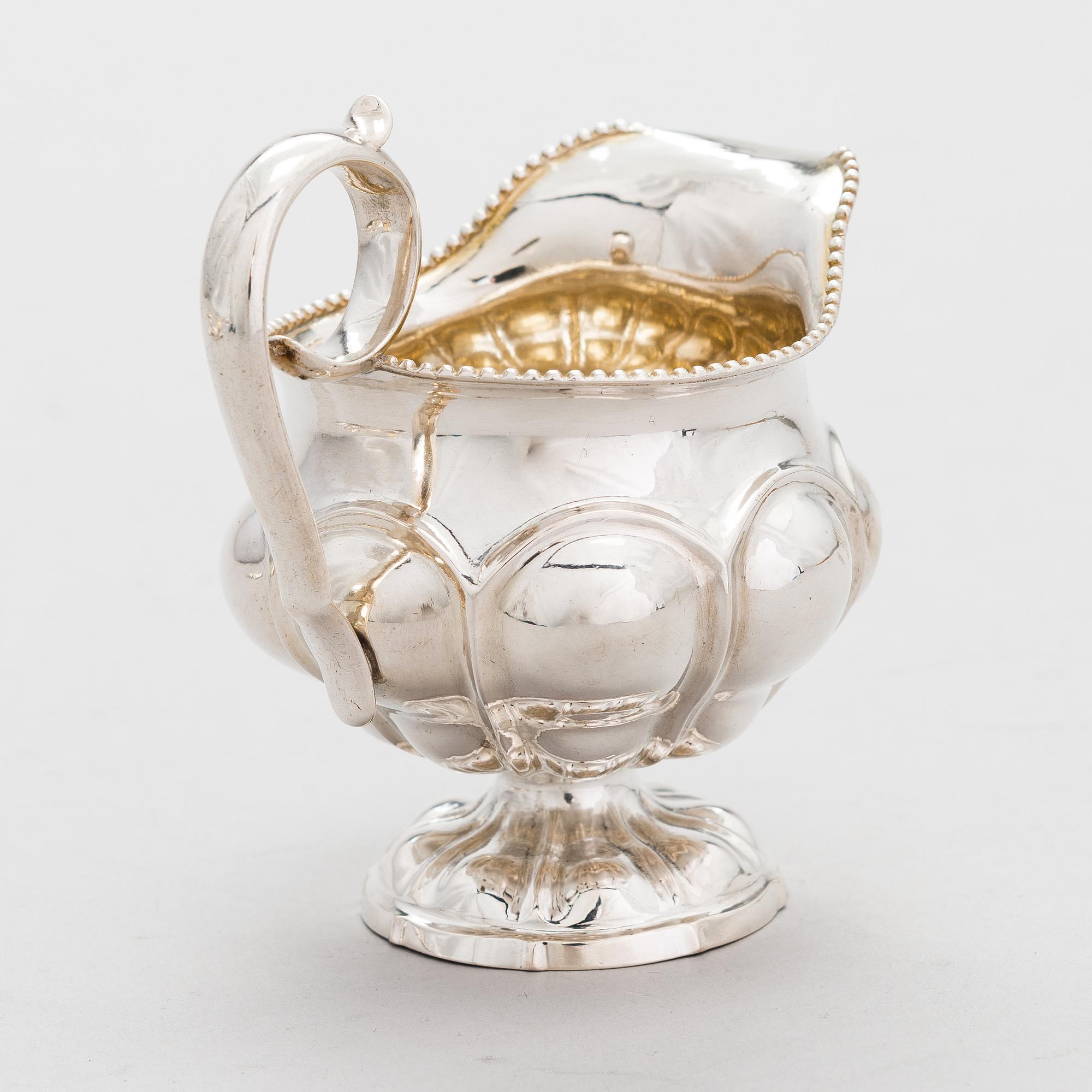 GUSTAF ADOLF BJÖRKLUND, Strösked, gräddsnäcka och skedar, silver, totalt 18 delar, Joensuu, Finland 1870.