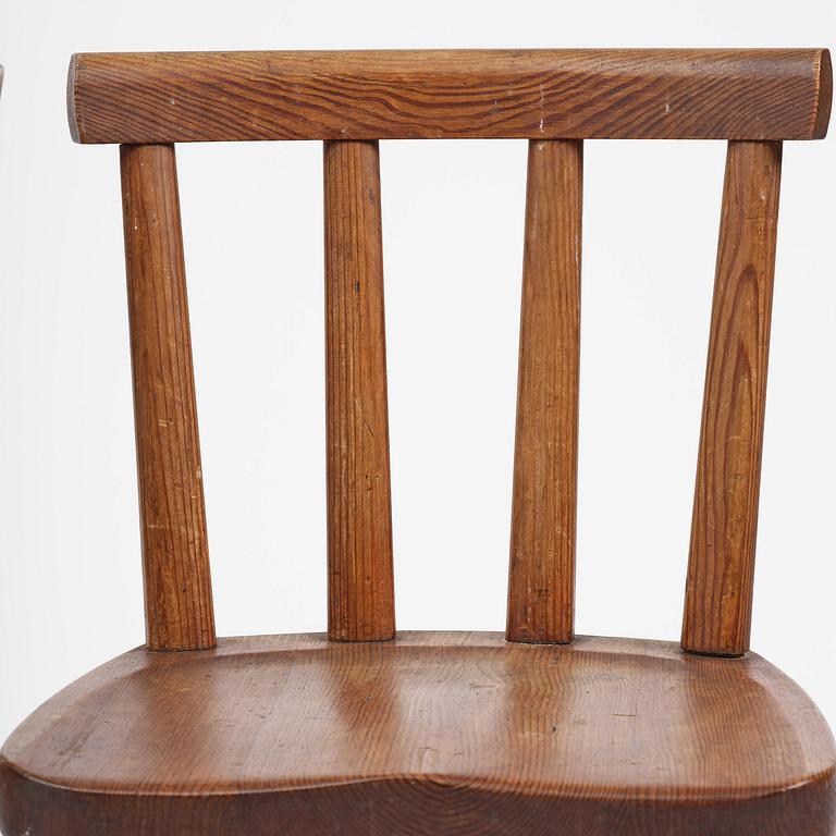 Axel Einar Hjorth, a set of four stained pine "Utö" chairs, Nordiska Kompaniet, Sweden, 1930s.