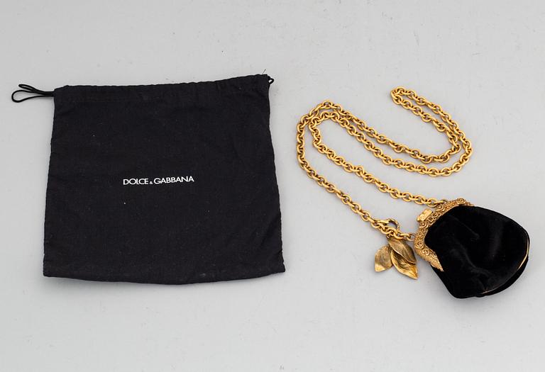 DOLCE & GABBANA, a black velvet evening bag.
