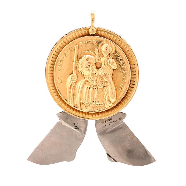 A 14K gold and steel medallion with knives.