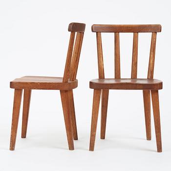 Axel Einar Hjorth, a pair of stained pine 'Utö' chairs, Nordiska Kompaniet, Sweden 1930s.