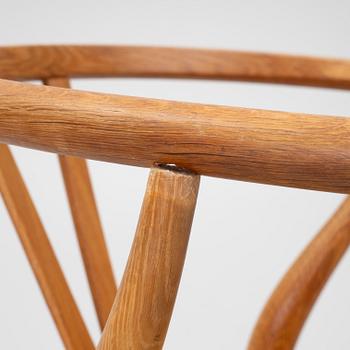 Hans J. Wegner, four model CH-24/ 'Wishbone' chairs, Carl Hansen, Odense, Denmark, second half of the 20th century.