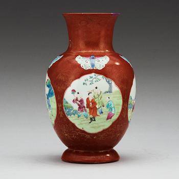 A coral ground famille rose vase, Qing dynasty.