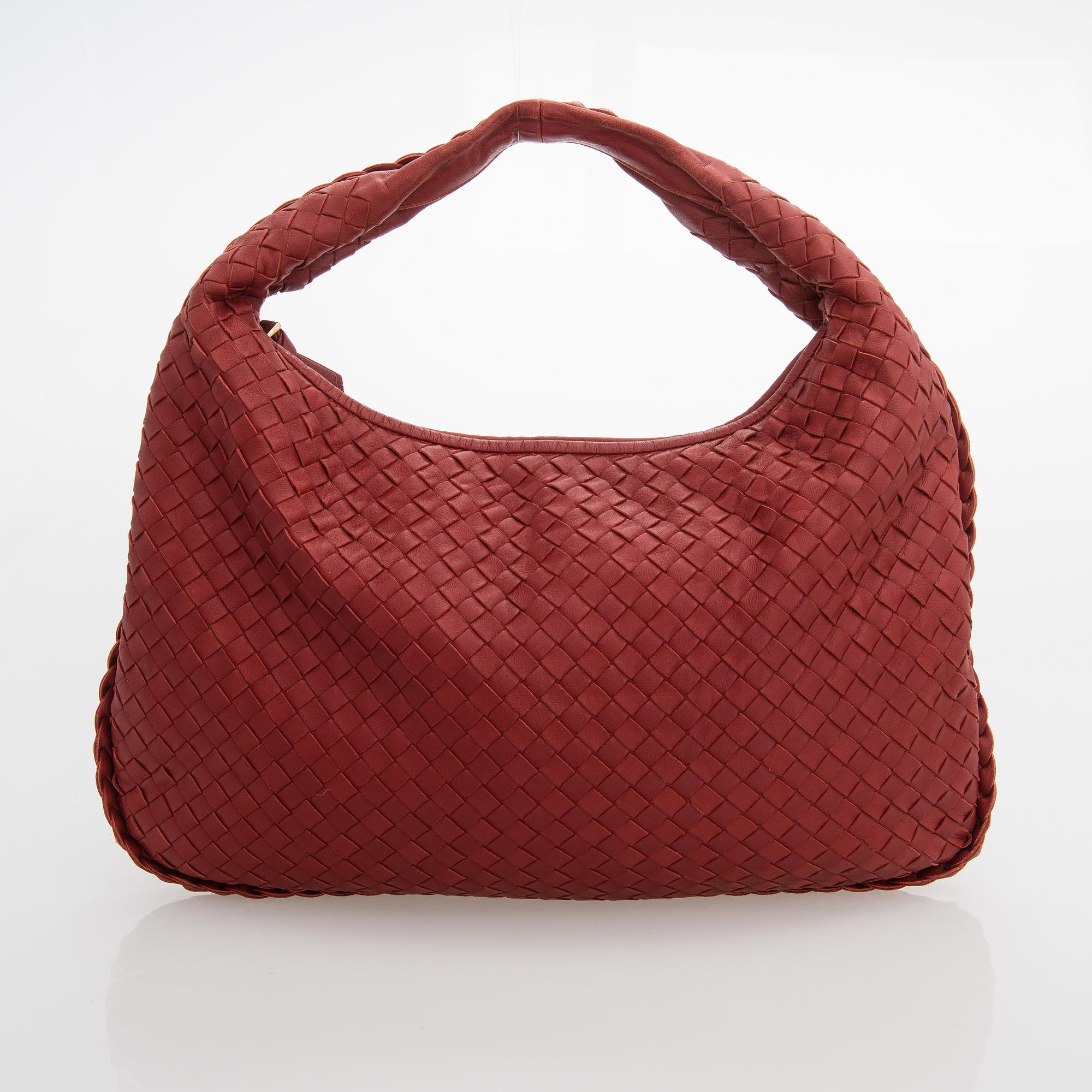 Bottega Veneta, a red leather 'Veneta' Bag.