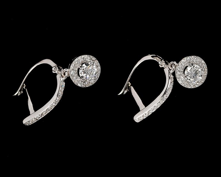 EARRINGS, brilliant cut diamonds, 0.30 cts each and app. 0.60 cts smaller, app. G/VS.
