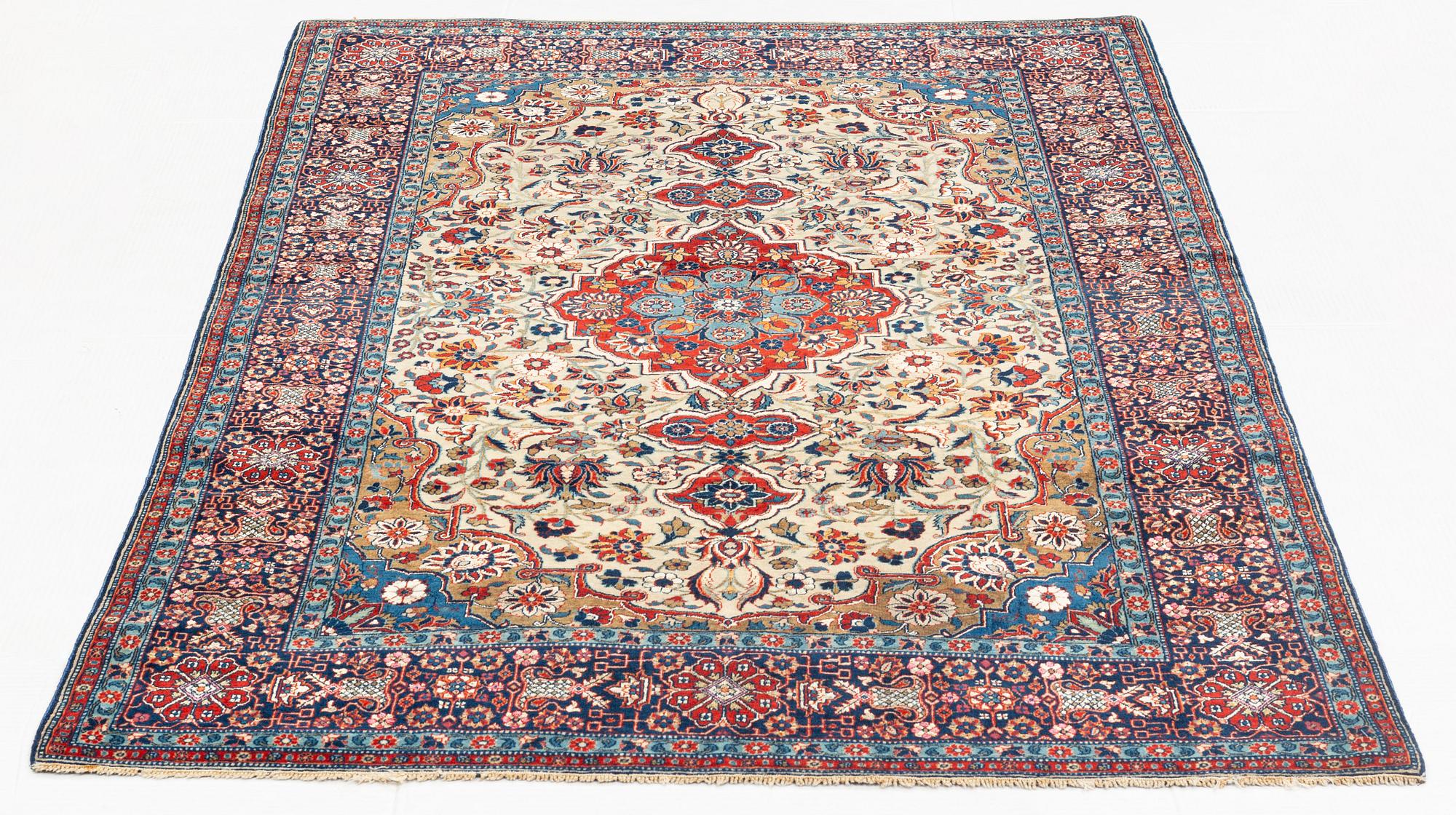 A rug, semi-antique, Teheran, part silk, 204 x 132 cm.