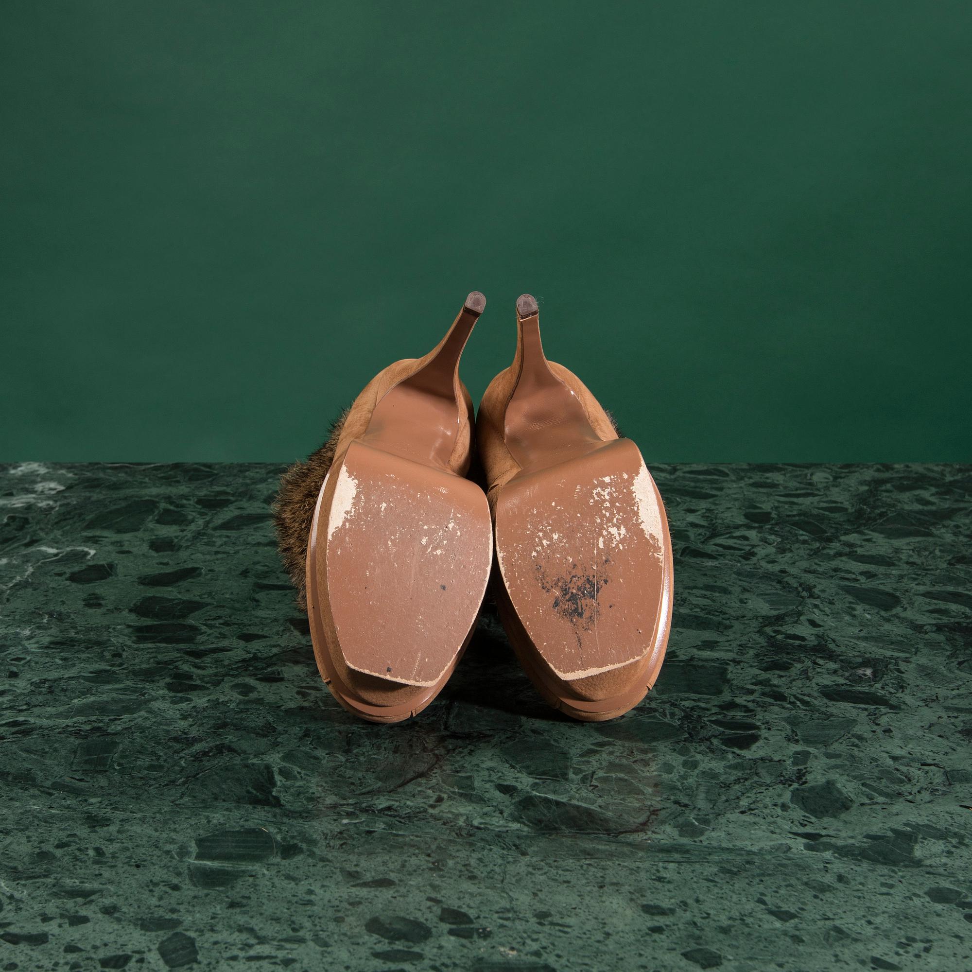 A pair of boots by YVES SAINT LAURENT,in size 37.