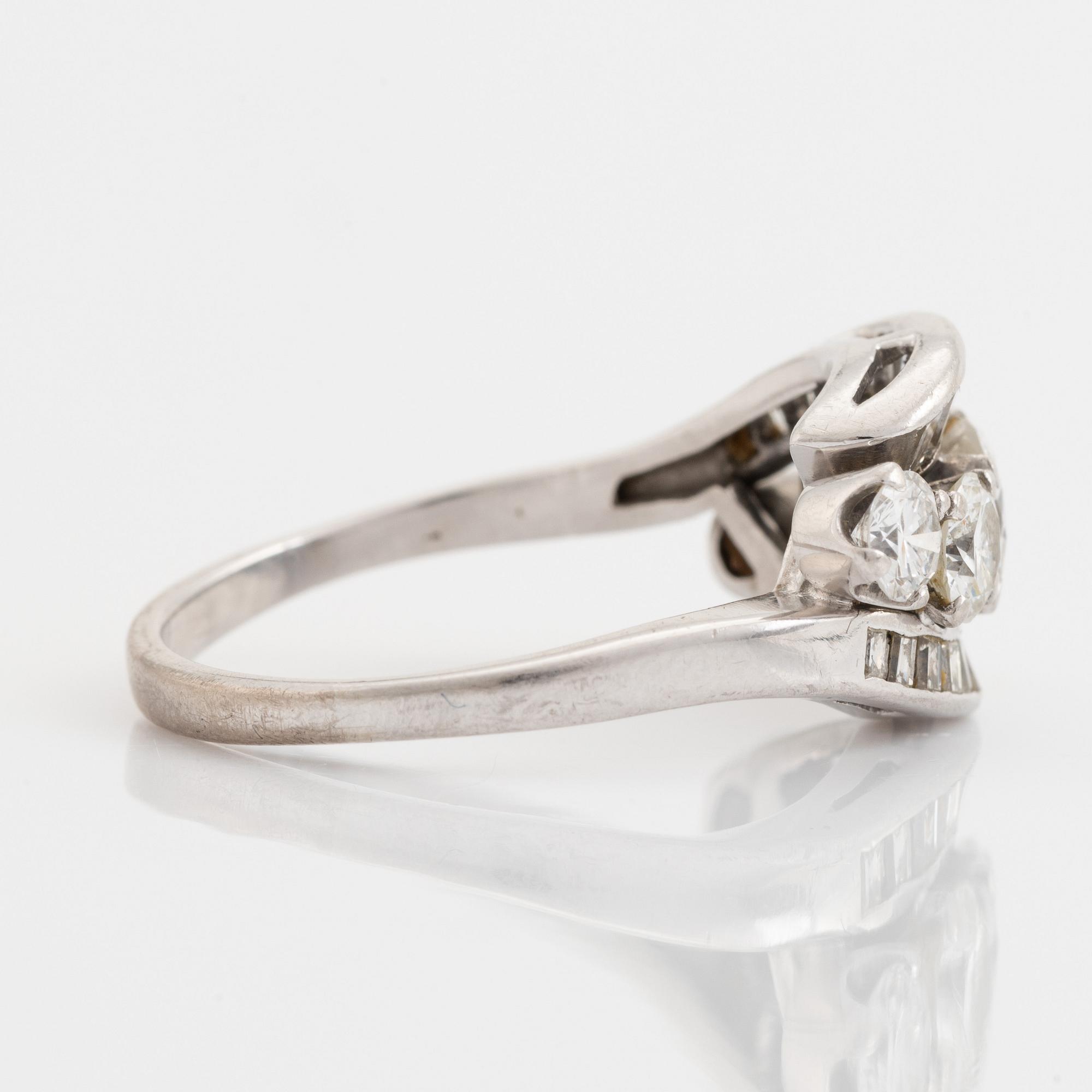 Platinum, brilliant and baguette cut diamond ring.