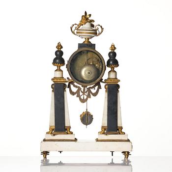 A marble and ormolu Louis XVI portico mantel clock, Paris, late 19th century.