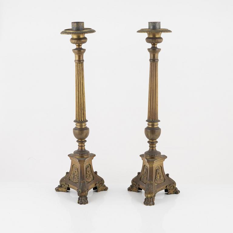 A pair of Baroque style brass altar candleholders, circa 1900.