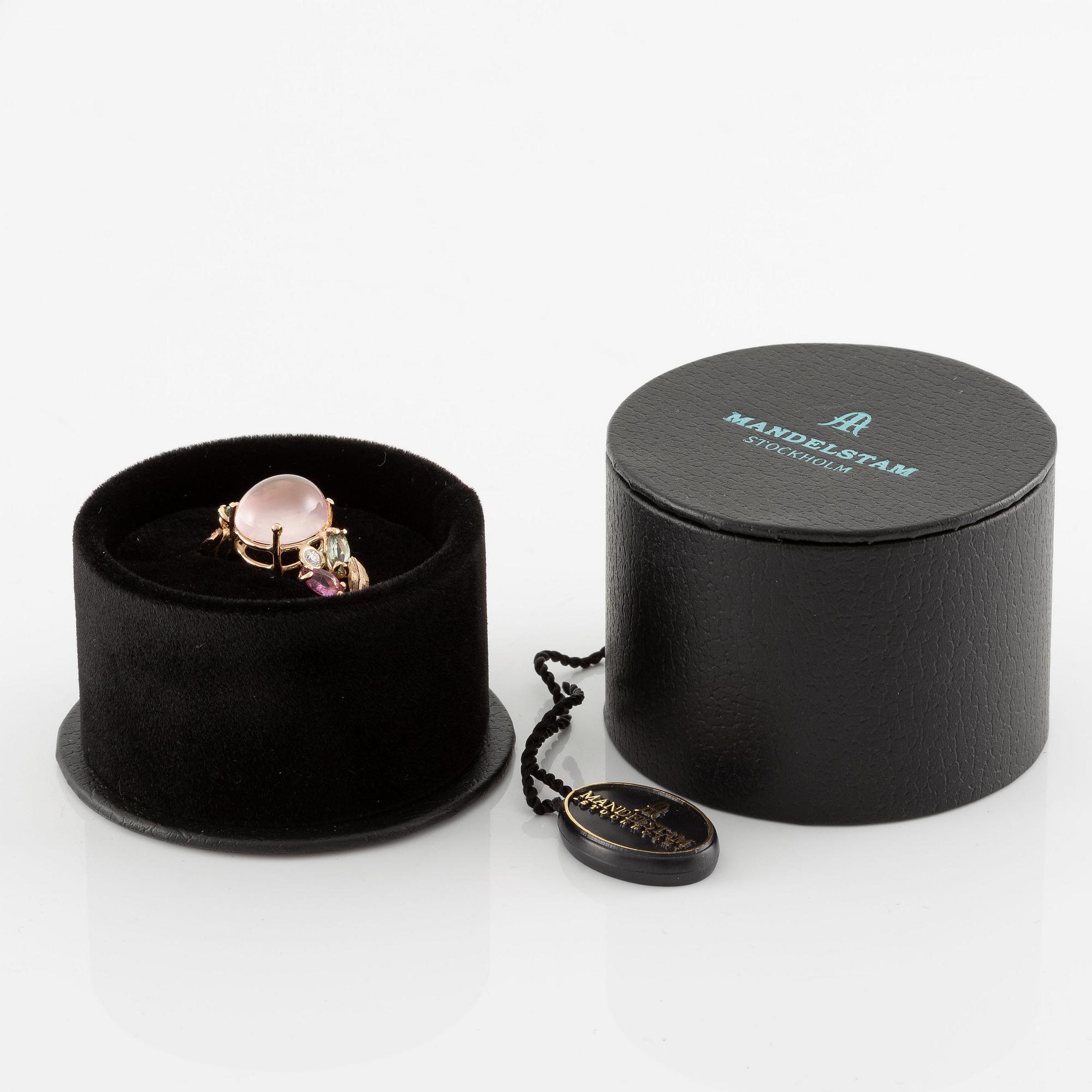 Ring in 18K gold set with a cabochon-cut rose quartz, green and pink tourmalines, and brilliant-cut diamonds.